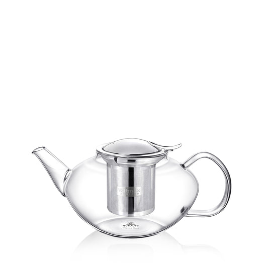 A clear glass teapot with a 600ml capacity. It has a stainless steel lid with a small handle on top and a metal infuser inside for brewing tea. The teapot has a curved spout and a glass handle for easy pouring. The brand name 'Wilmax England' is engraved on the infuser and bottom of teapot. The teapot is sitting on a plain white surface.